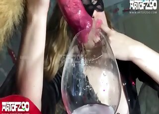 Blonde in boots is draining canine cum before passionately drinking it