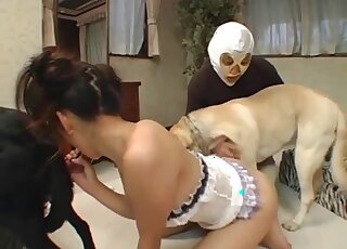 Attractive Asian getting spit-roasted by two animals at once