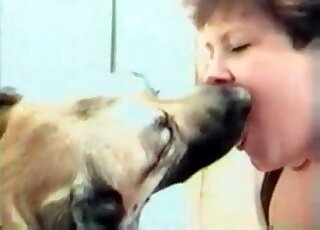 Chubby whore sucks dog's shaft during an exciting XXX zoo action