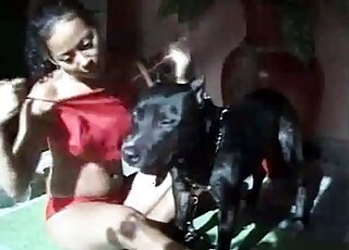 Nasty Latina brunette is trying to seduce her dog for sex