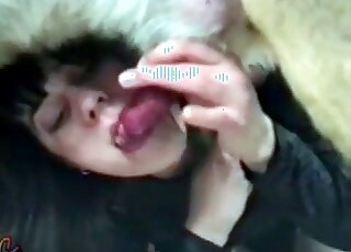 Pale-skinned chick dressed in black deepthroating a dog's boner