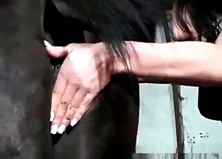 Brunette fisting a mare in a rare bestiality lesbian sex scene