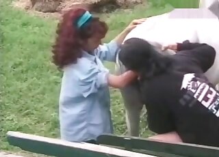 Curly slut is busy fisting the tight hole of a horse outdoors