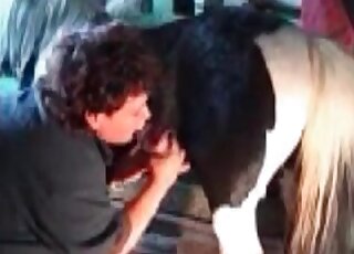 Mature stimulates horse’s cock with her pierced tongue in a closeup vid