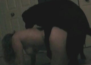 Naughty MILF fucked by dog in a doggystyle for a homemade video