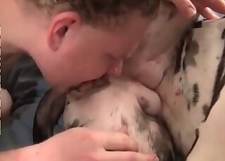 Dirty-minded guy licks pussy of his female dog in a zoo porno video