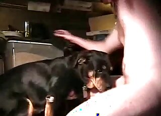 Pasty-ass dude is happy to fuck his dog's throat in a zoo porn here