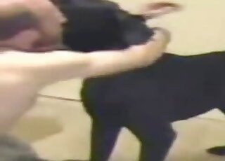 Zoophile guy with sexy balls fucks black dog anally back at home